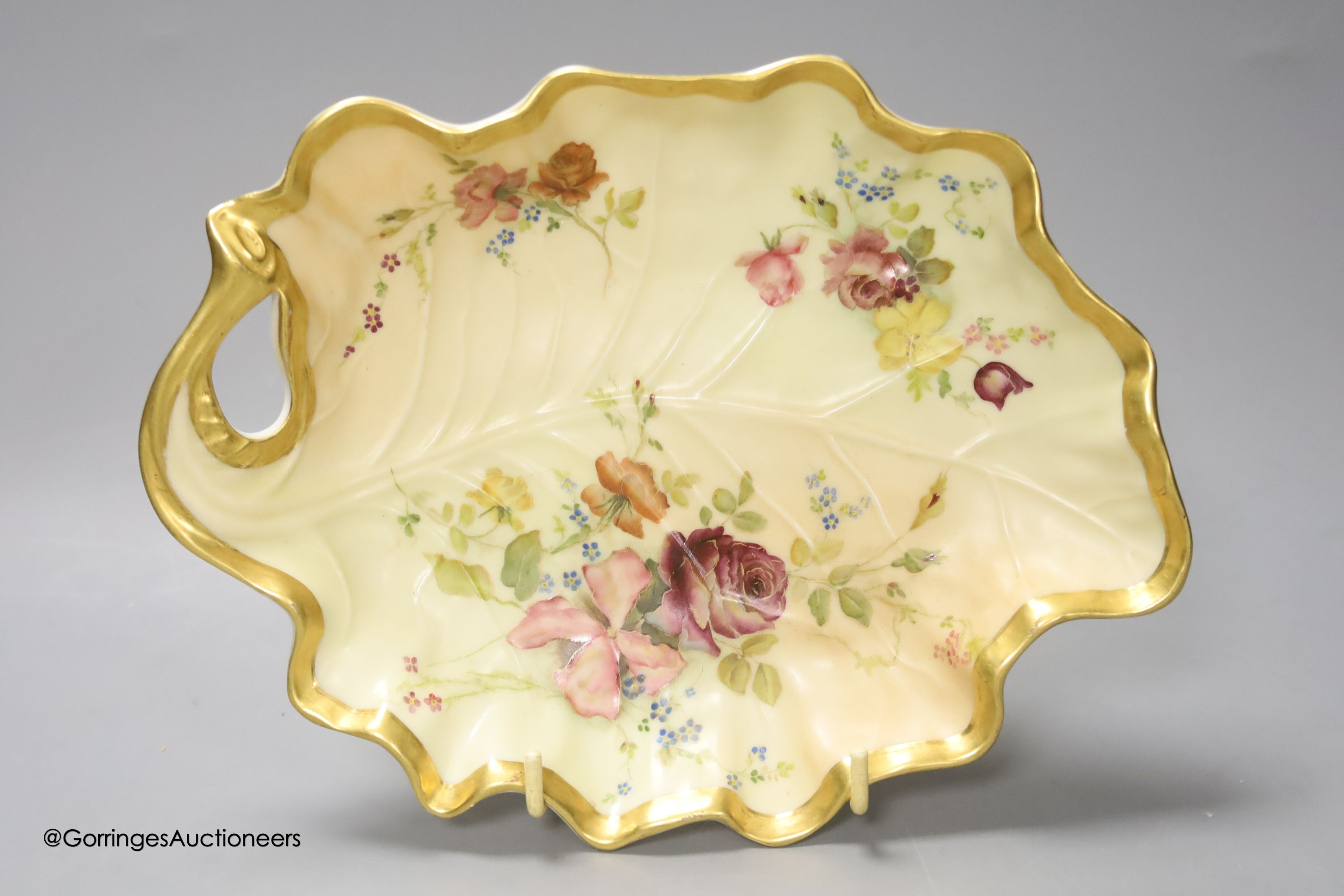 A Royal Worcester blush leaf dish, a pair of ewers, a two handled vase and another